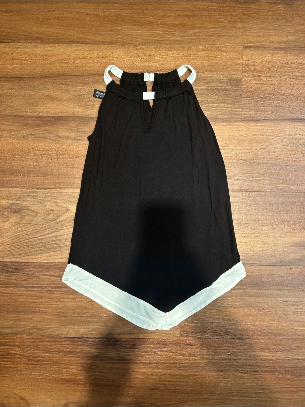 Black Sleeveless Top with White Trim and Pointed Edge